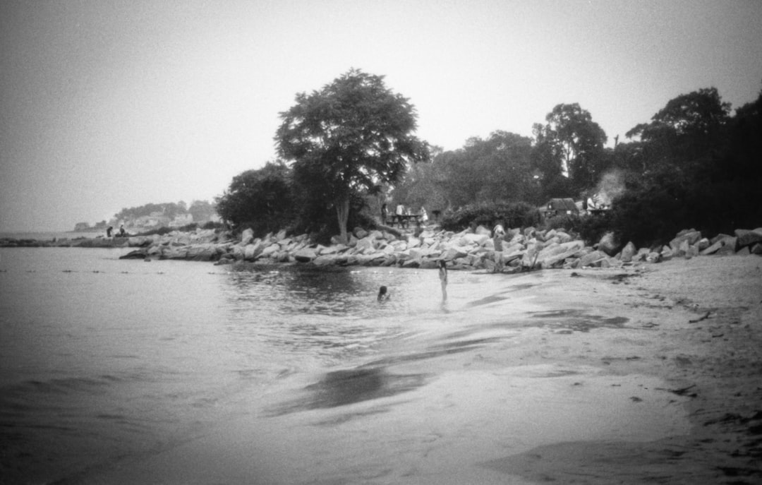 A black and white photo of a person in the water